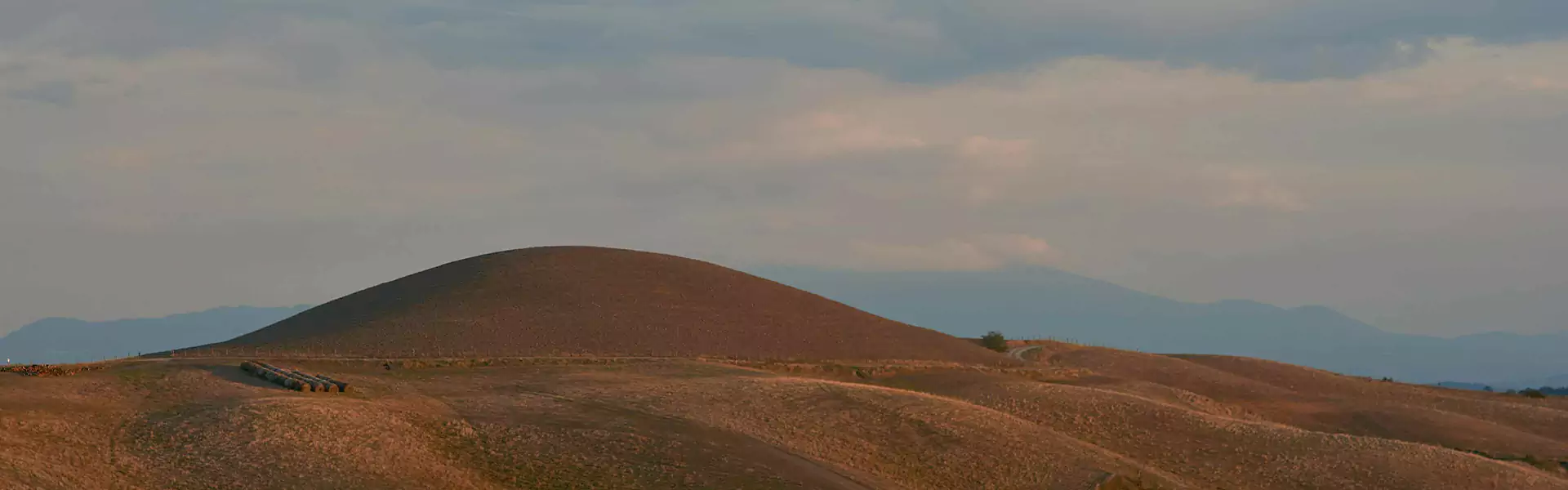 Rolling hills under a cloudy sky