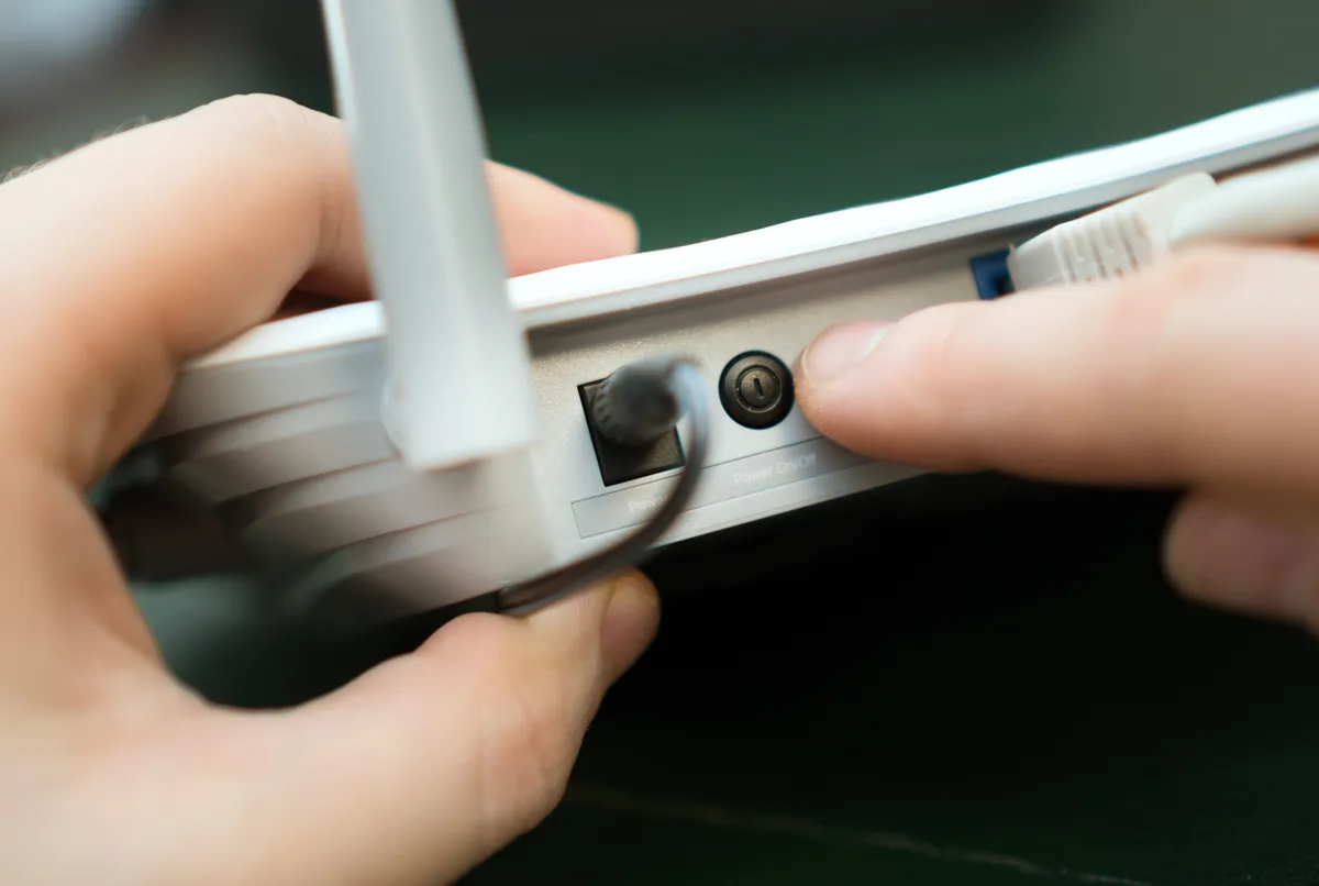 Close-up of a person connecting a device
