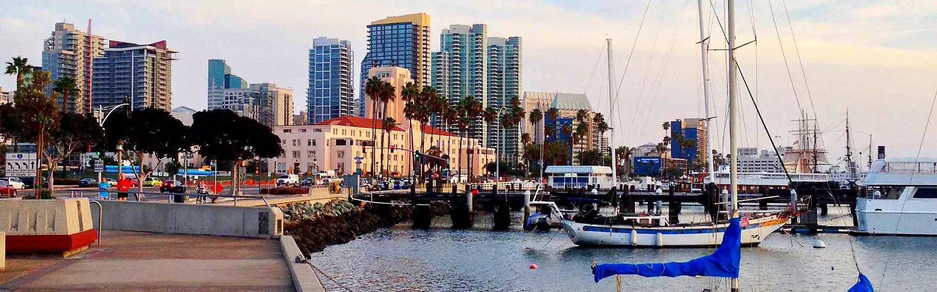 Waterfront view of cityscape with boats.
