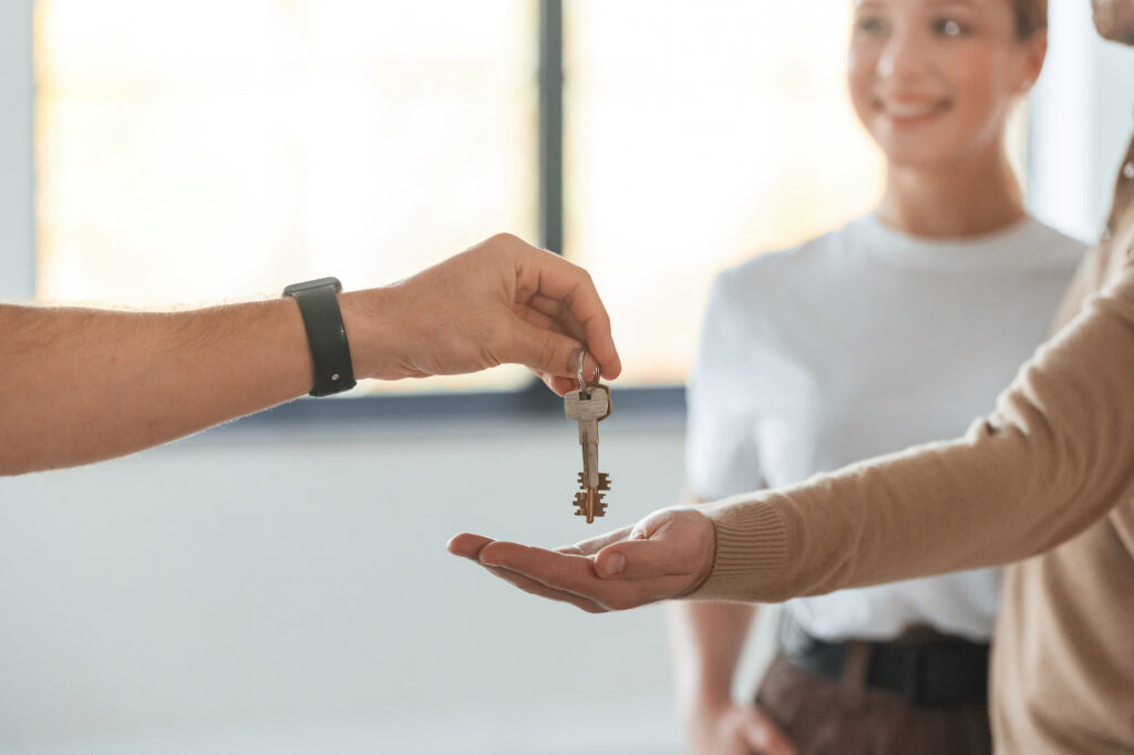 Handing over keys during a property transaction.