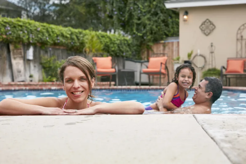 Family enjoying a fun day by the pool.