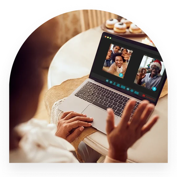 Person video chatting with family on a laptop.