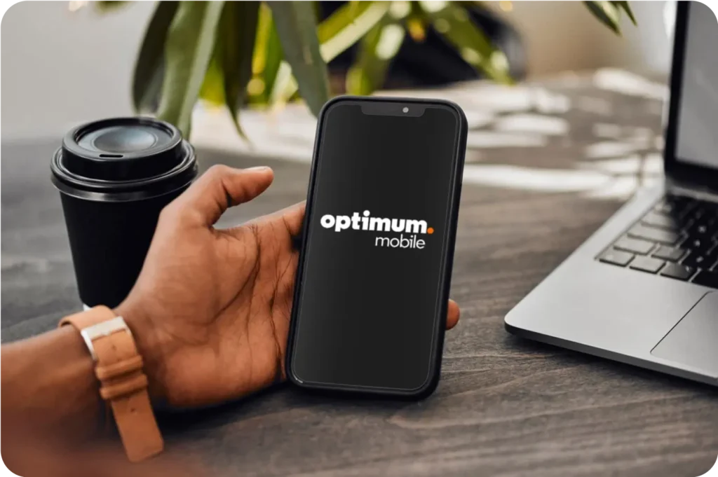 Hand holding smartphone displaying Optimum Mobile logo.